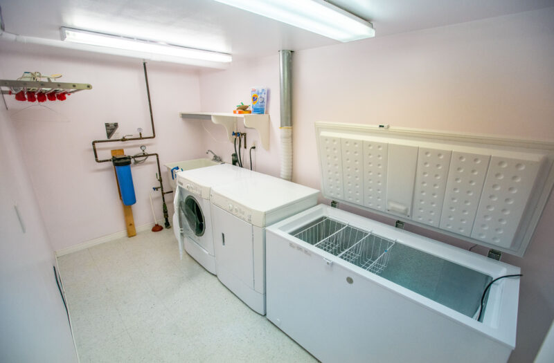 Separate laundry room in basement